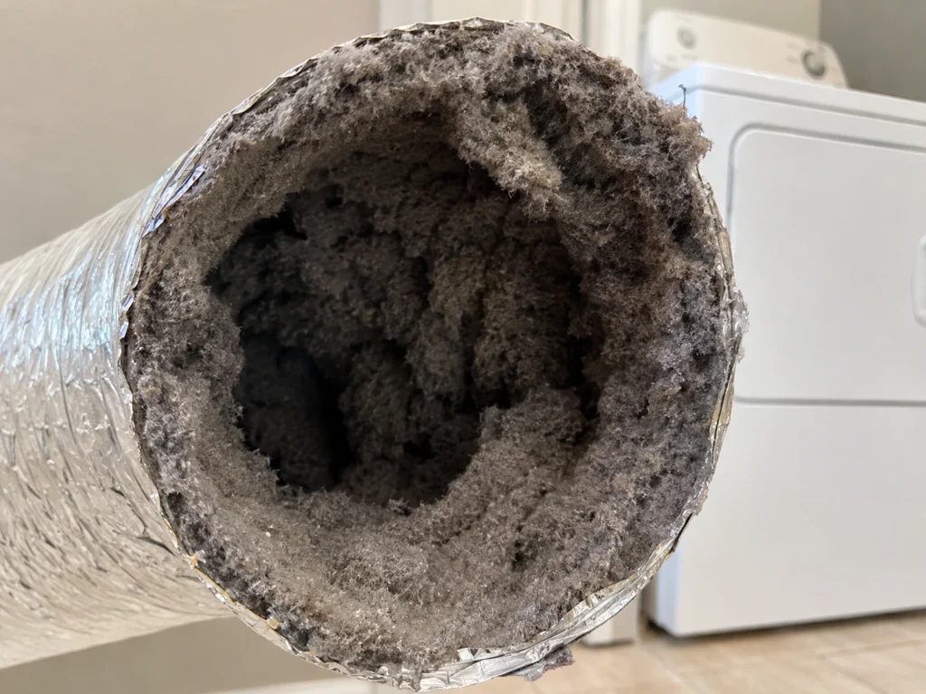 Dryer vent severely clogged with lint buildup before SafeFlow cleaning in Maryland
